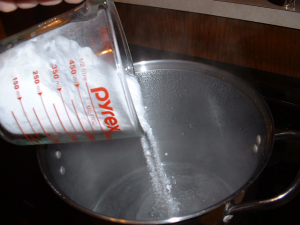 Pouring Sugar in Boiling Water